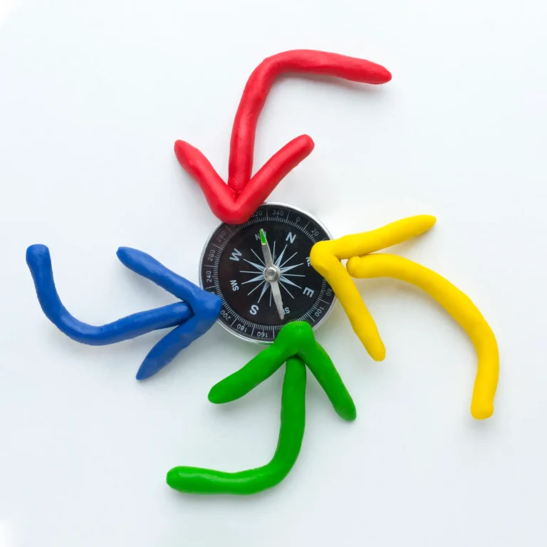 top-view-colorful-arrows-pointing-compass